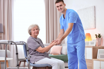 caregiver and senior woman smiling