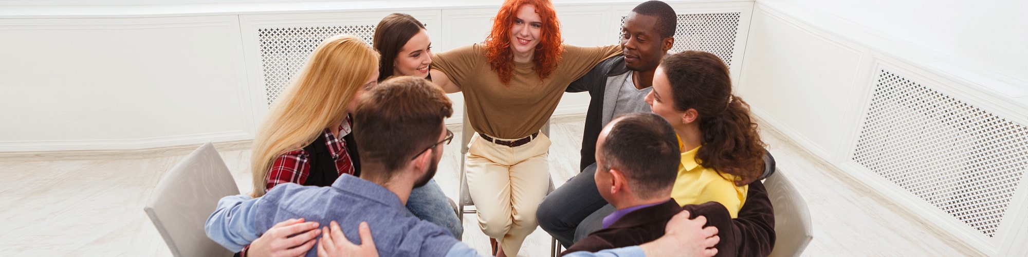 group of people on a huddle